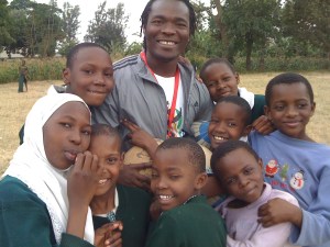 ARDP founder Juma Kittyler with at-risk kids at Arusha school.