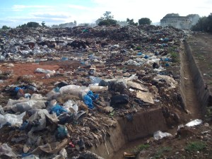 smoke rises from rubbish