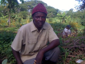 John Melaulaizer takes a pause from work on the Kesho Leo farm