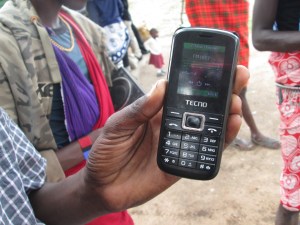 Mindey Ndoinyo with his mobile tuned into Loliondo FM
