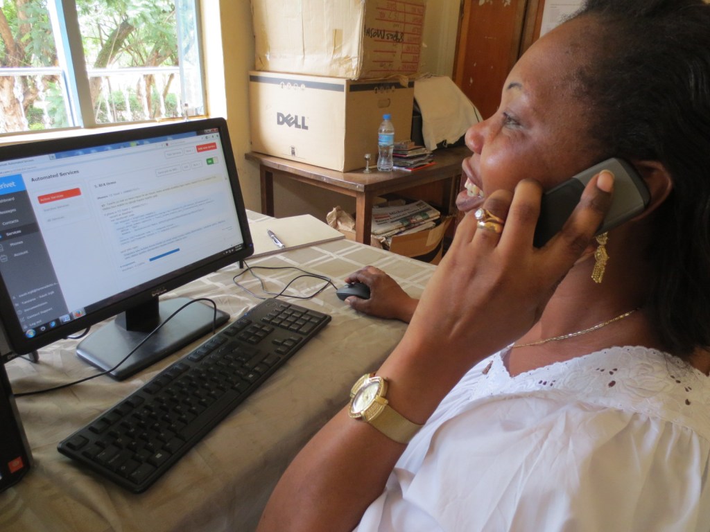 Helen Madege of Radio Sauti ya Injili demonstrating the Beep4Weather service.