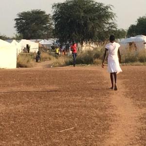 Chuol walks home from work to site two