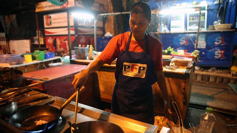 A street vendor cooks Pad Thai in Bangkok, Thailand [Godong:UIG via Getty Images]